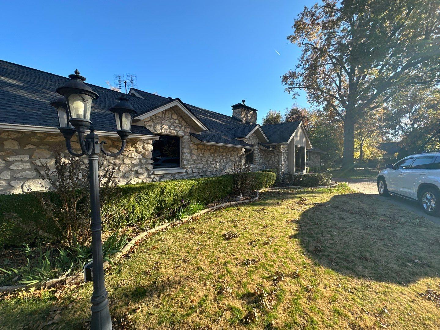 Completed charcoal architectural shingle roof on an Oklahoma home