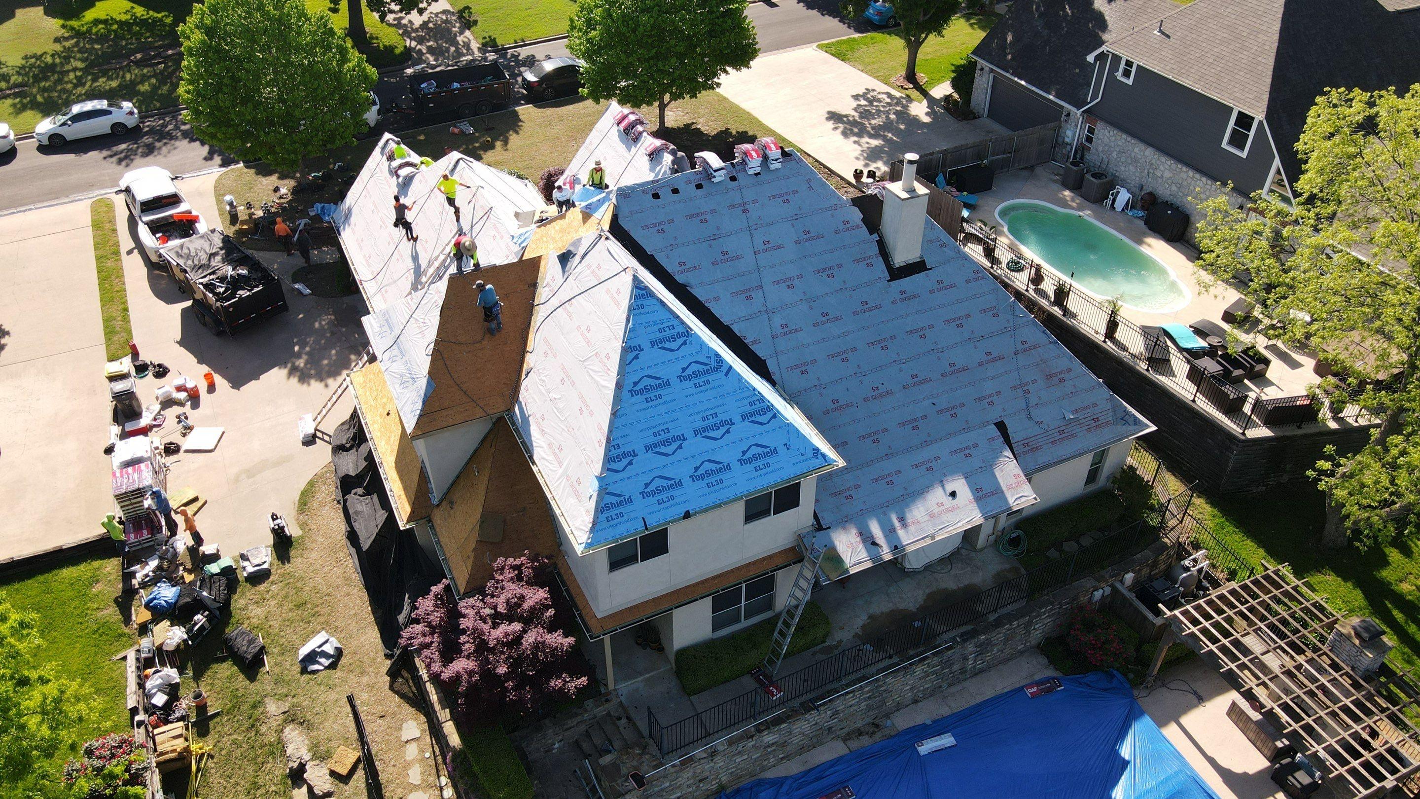 A finished Average Joes Construction roof at golden hour