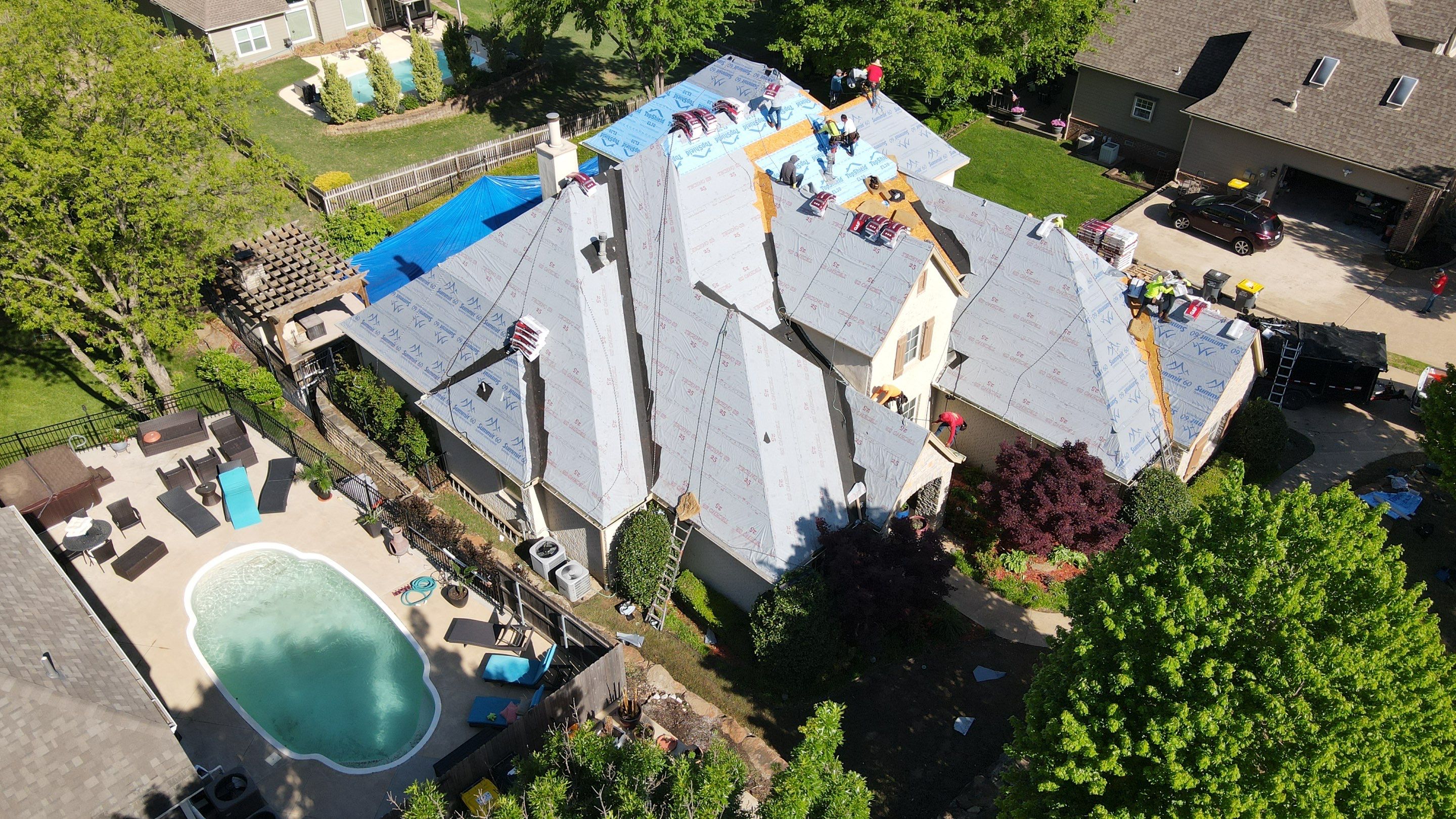 AJC crew installing new roof in Jenks Oklahoma — aerial drone shot