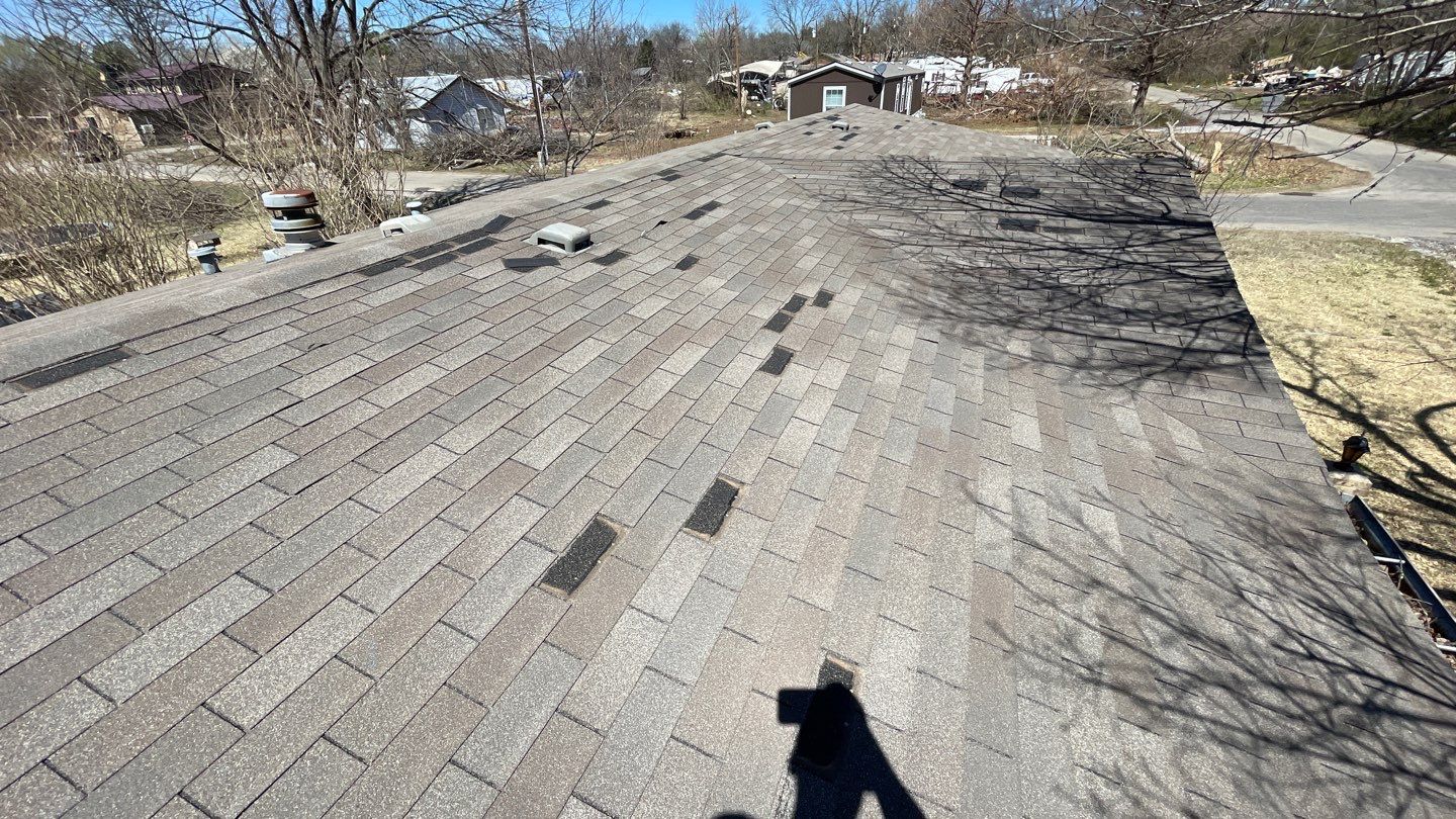 Oklahoma lake home storm damaged roof before full tear-off