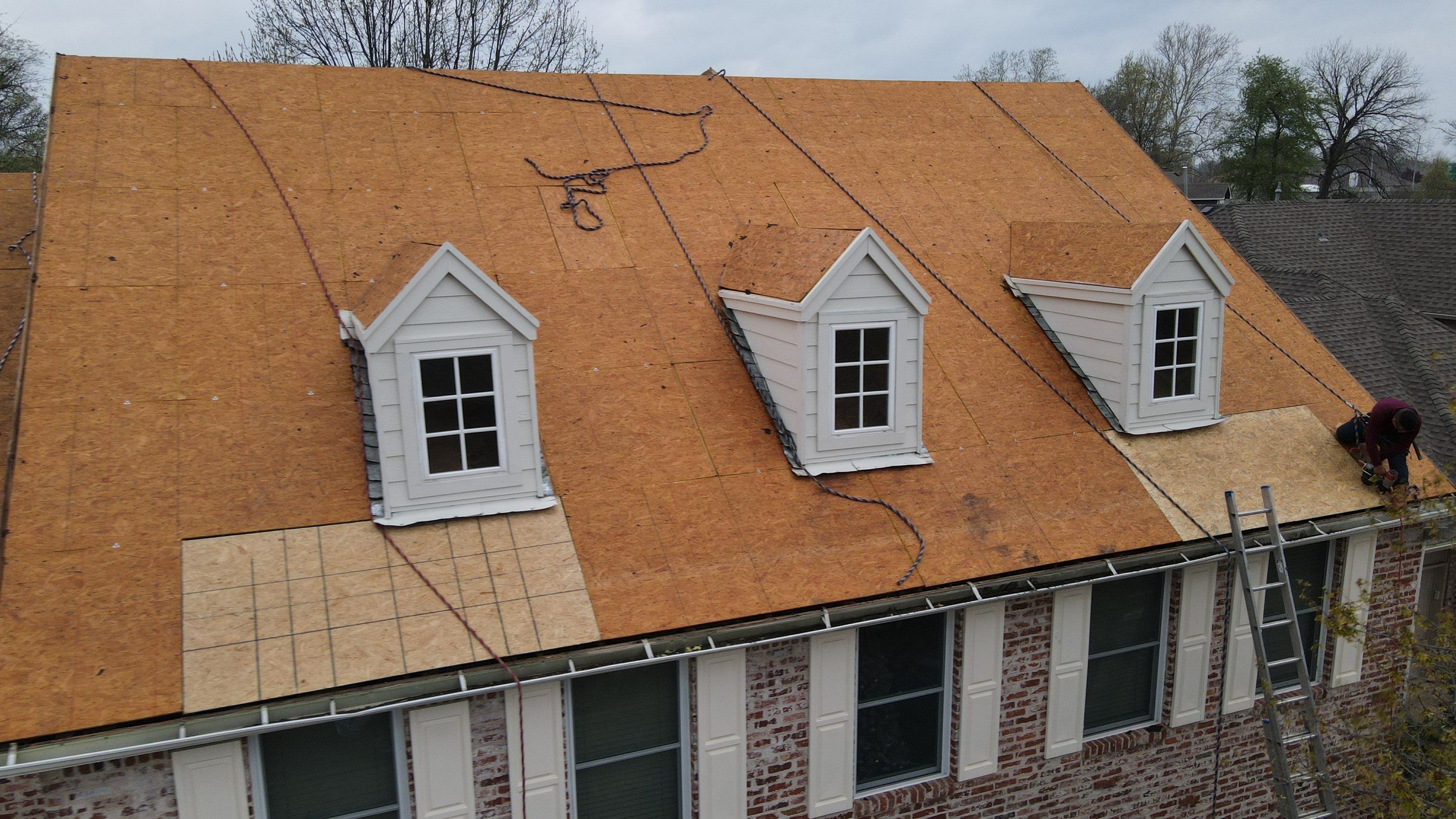 New OSB decking installation on residential dormer roof replacement
