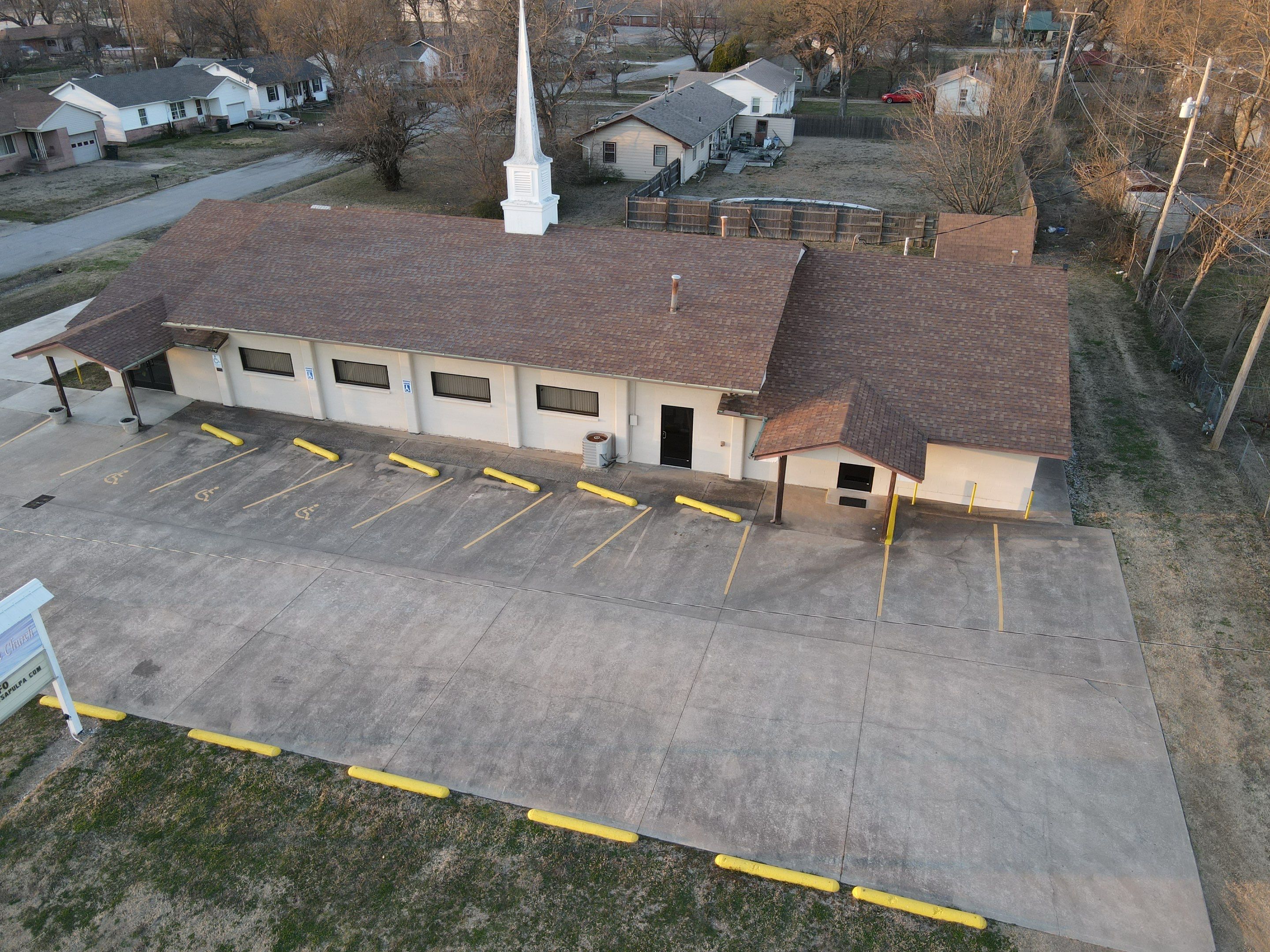 Beams of Light Sapulpa storm damaged commercial roof before replacement
