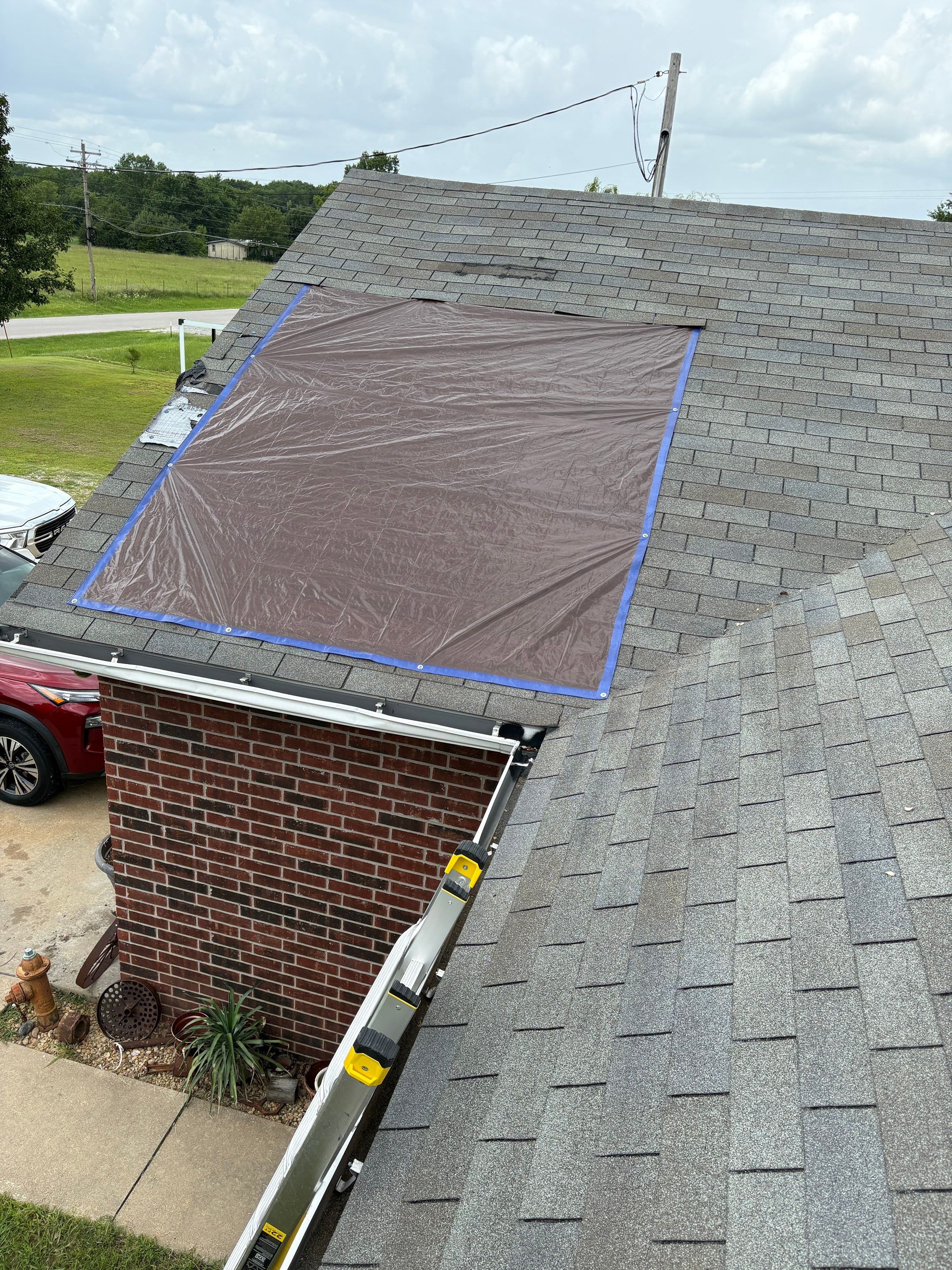 Sapulpa home storm damaged roof before Average Joes Construction full replacement